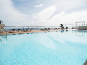 Sunny Apartment by the sea with a pool